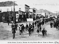 Golden Street, Rhyolite, Nevada, looking north- Miners' Union in parade. A. E. Holt, Publisher, Rhyolite, Nevada. 1906