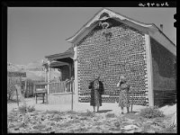 Rothstein, Arthur, photographer. Tourists visiting Bottle House. Rhyolite, Nevada. Mar. March 1940 Library of Congress 03