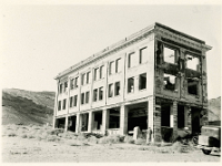 UNLV02 see description  The John S. Cook and Company building was built in 1907 on Ramsey Corner, corner of Golden and Broadway Streets. It opened in 1908 and became known as the First National Bank of Rhyolite, Nevada. Maurine and Fred Wilson Collection. Photo 1923 courtesy UNLV